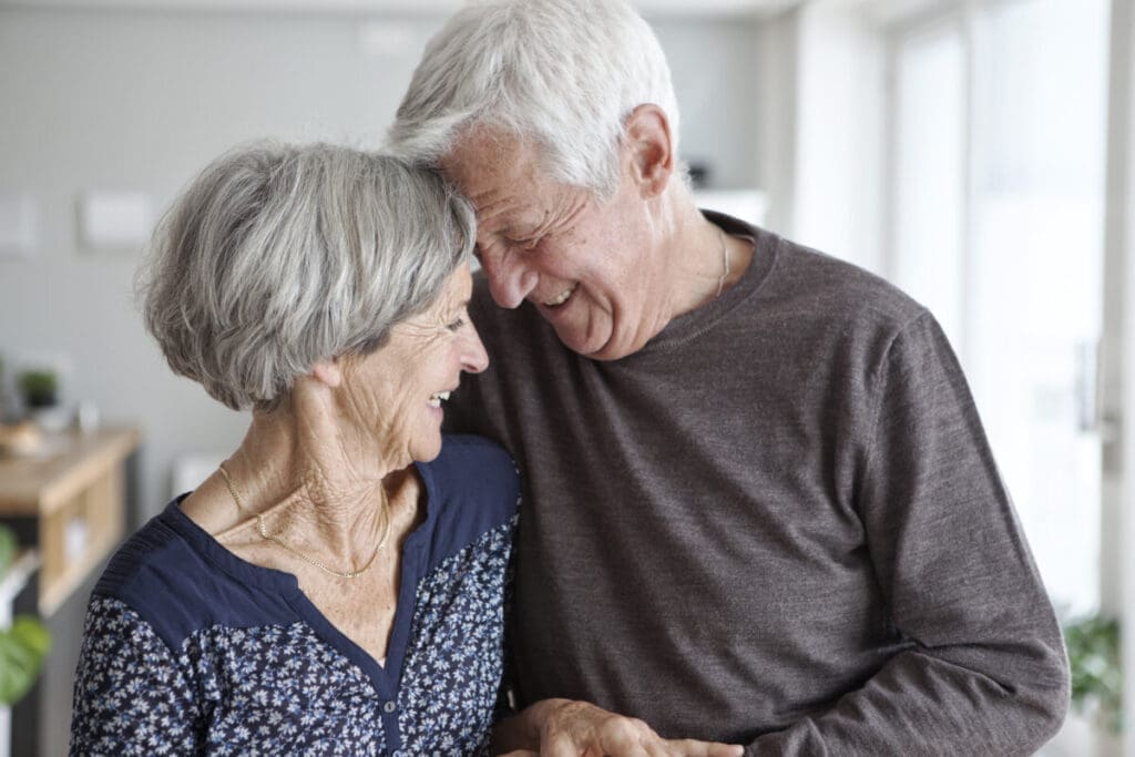 Happy senior couple at home after installing home satety upgrades